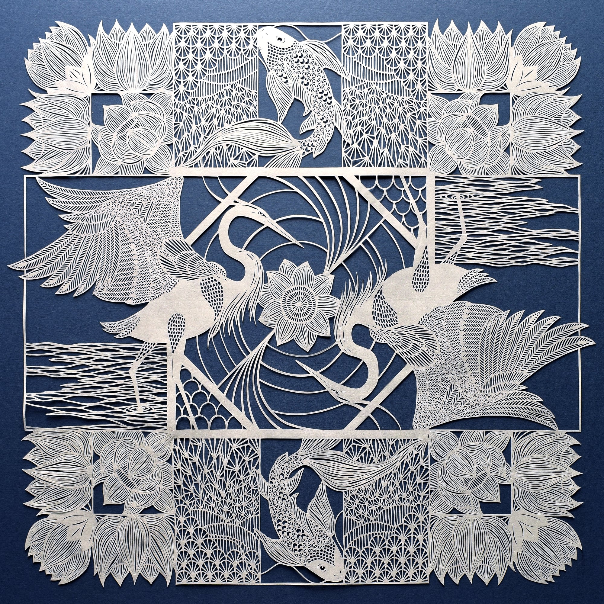 A square paper cut scene with herons, koi carp and flowers