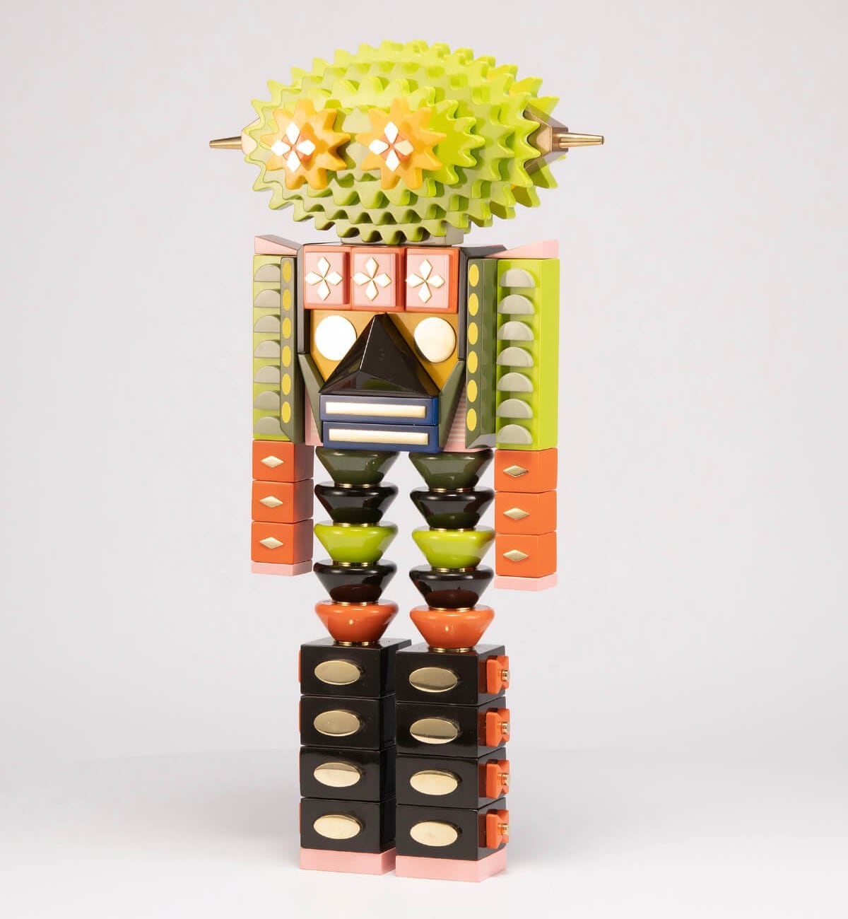 A robot with a pointed jackfruit-like head and a body made of geometric blocks