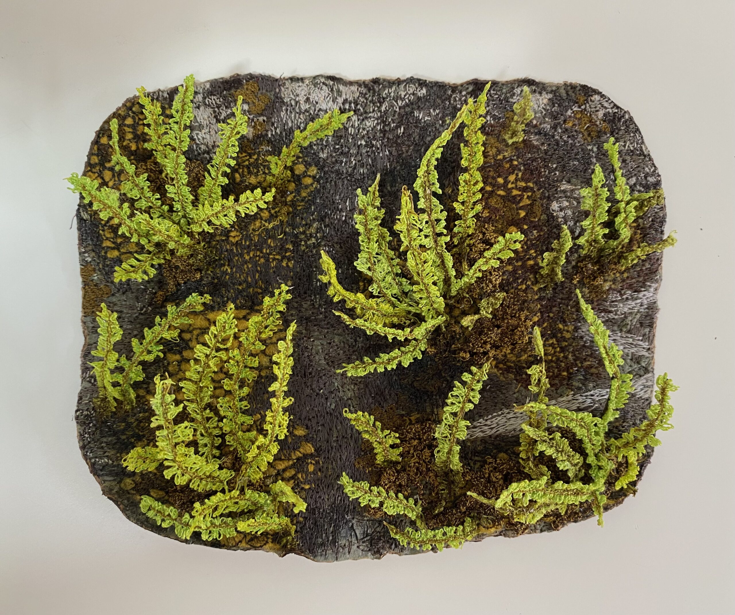 A realistic embroidery of maidenhair spleenwort