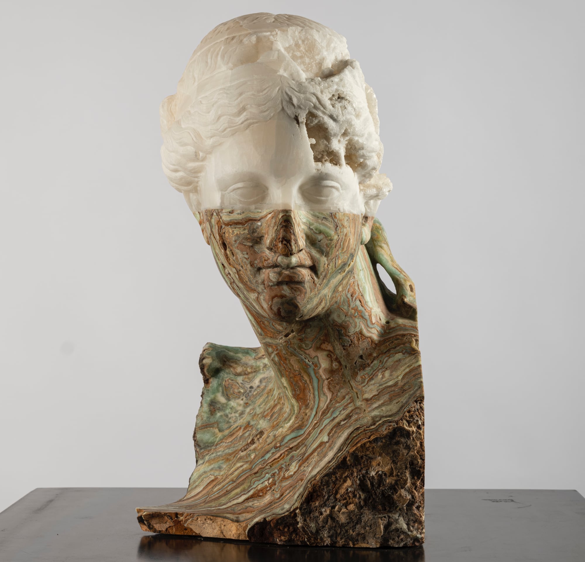 A bust spliced with white stone and green marbled stone