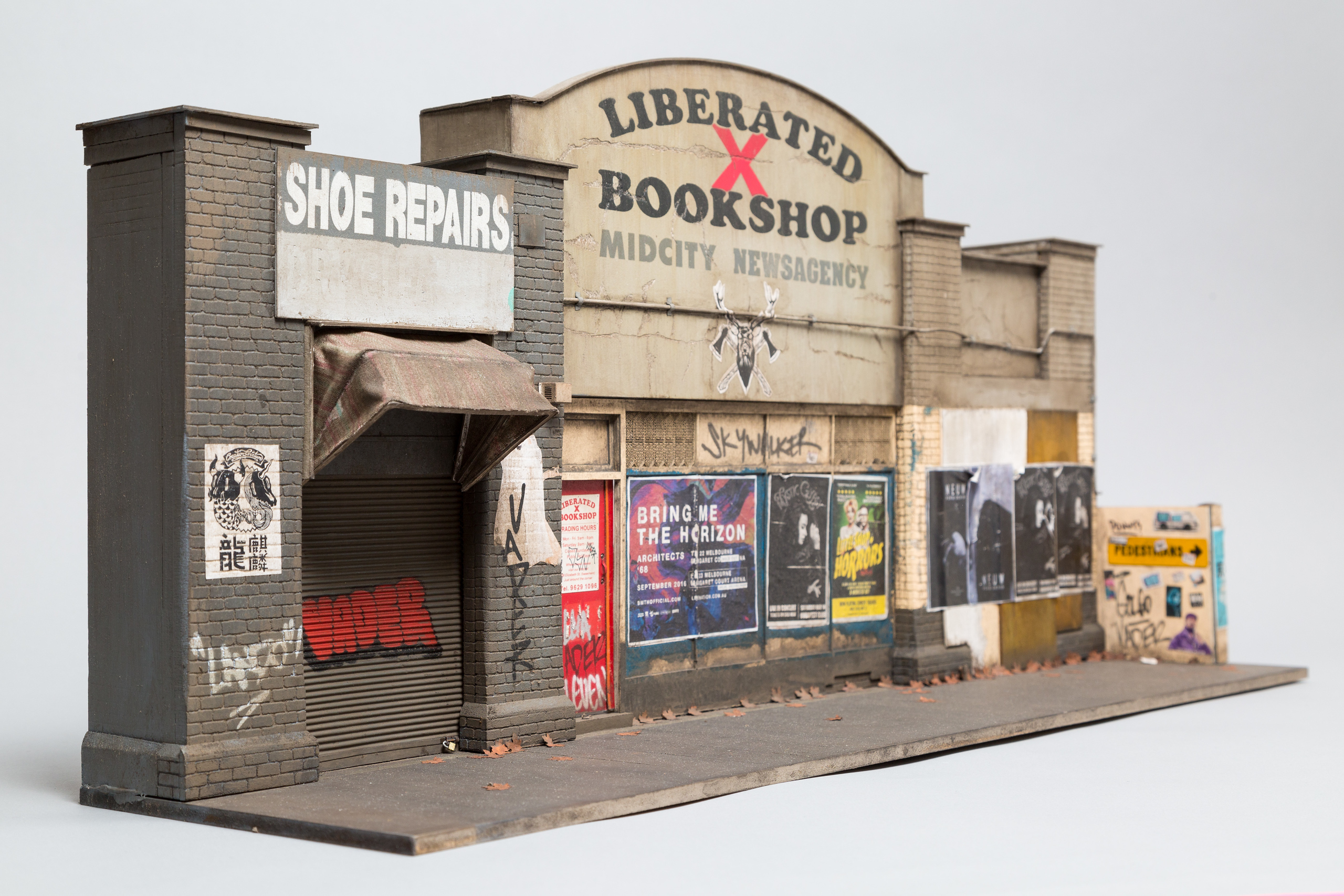 A miniature model facade of a run-down bookshop.