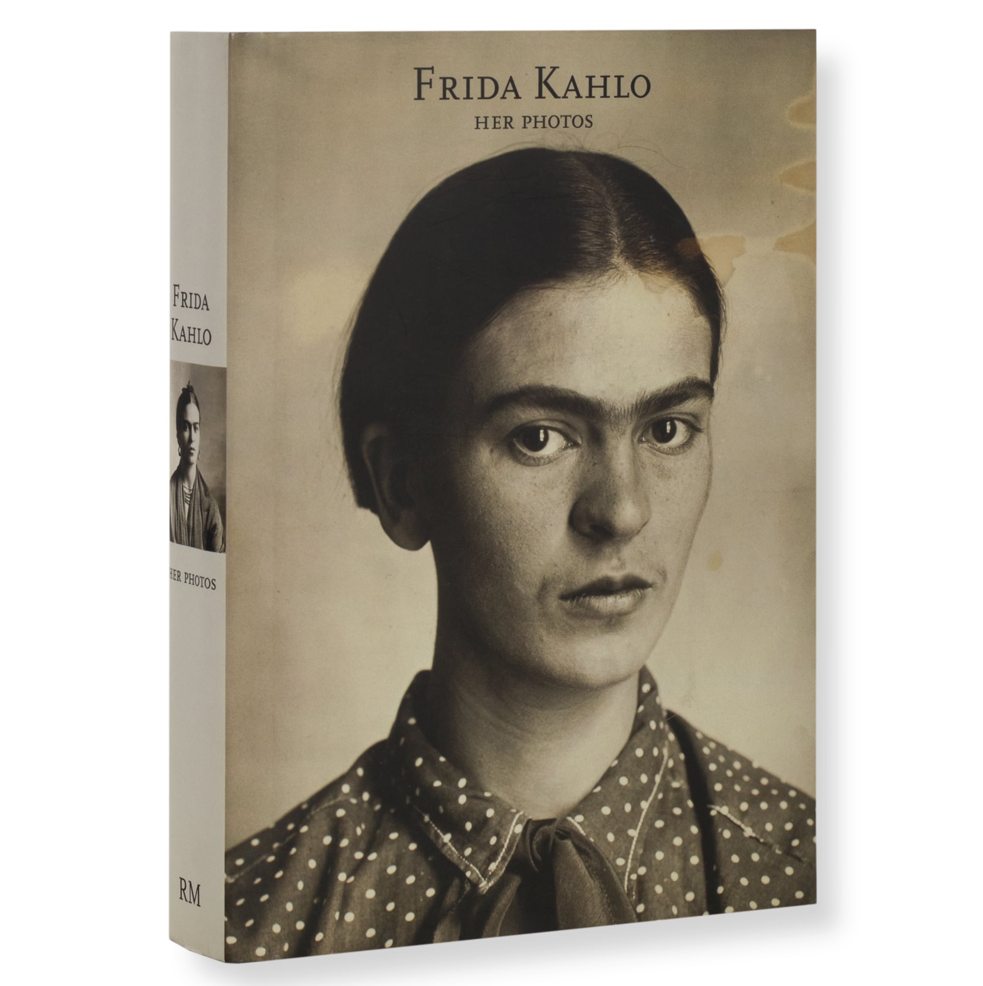 a book cover with a portrait of frida kahlo that says "frida kahlo her photos"