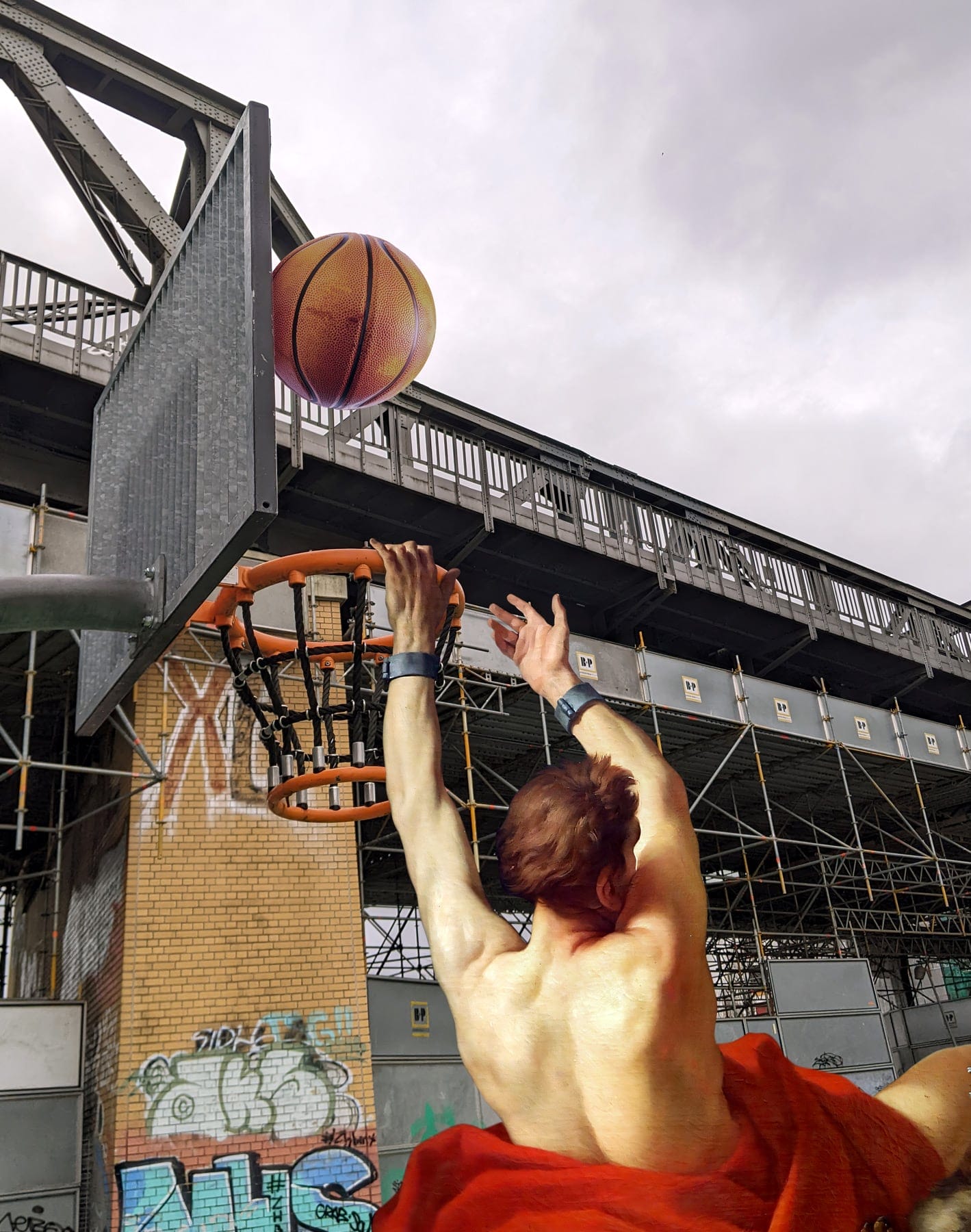 a man with a flowing red garment shoots a basketball at a hoop with graffiti and infrastructure in the background